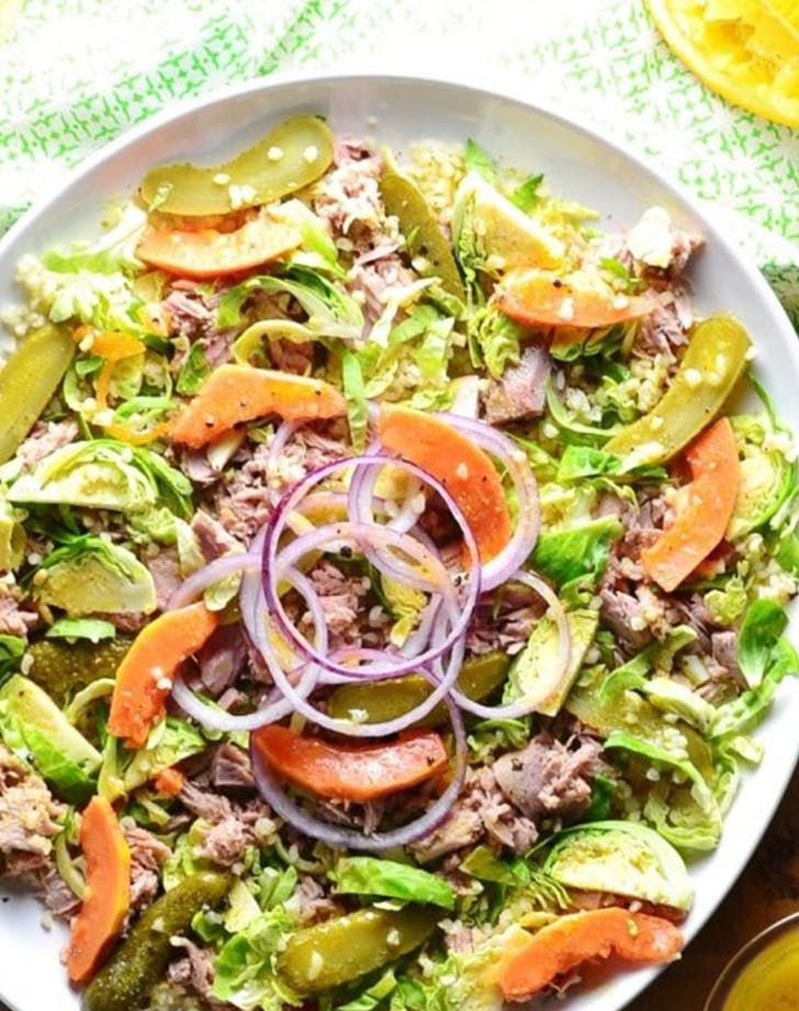 A delicious bowl of bulgur salad with fresh vegetables and a sprinkle of herbs