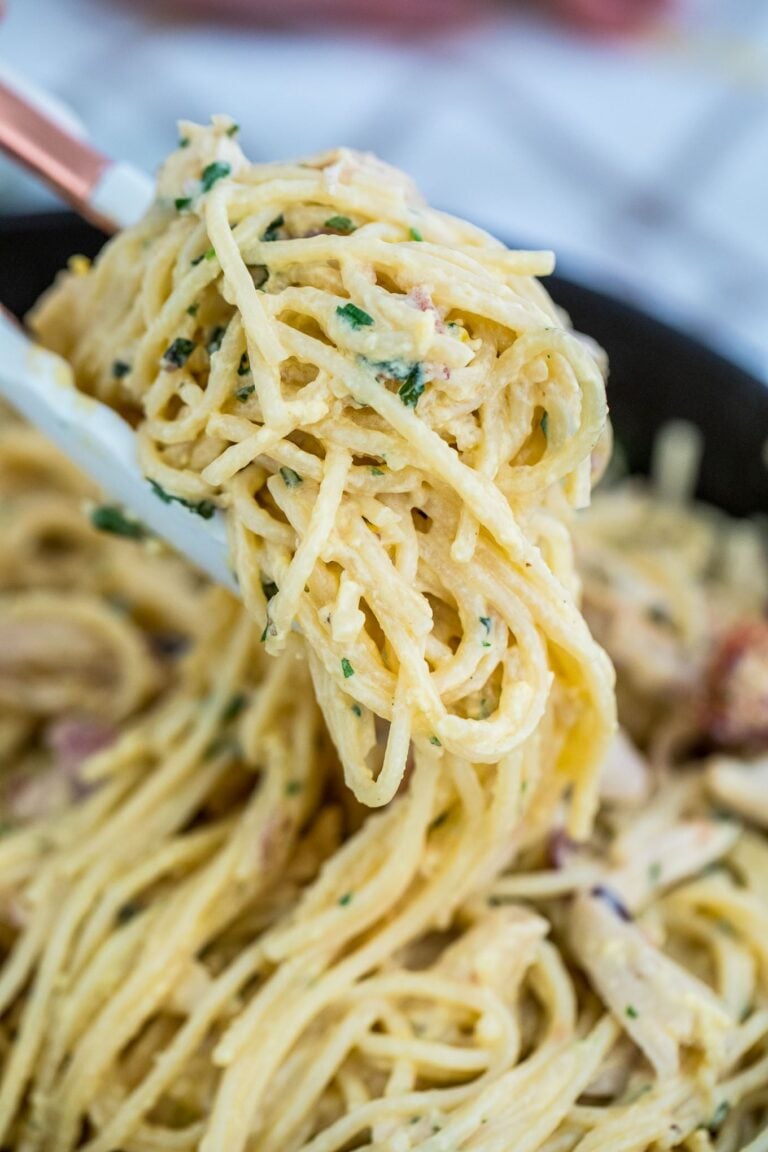 Best Chicken Carbonara Pasta with bacon and herbs on top